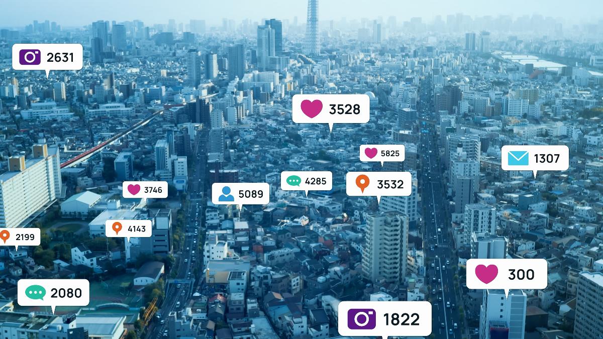 View of city buildings surrounded by social media notification icons